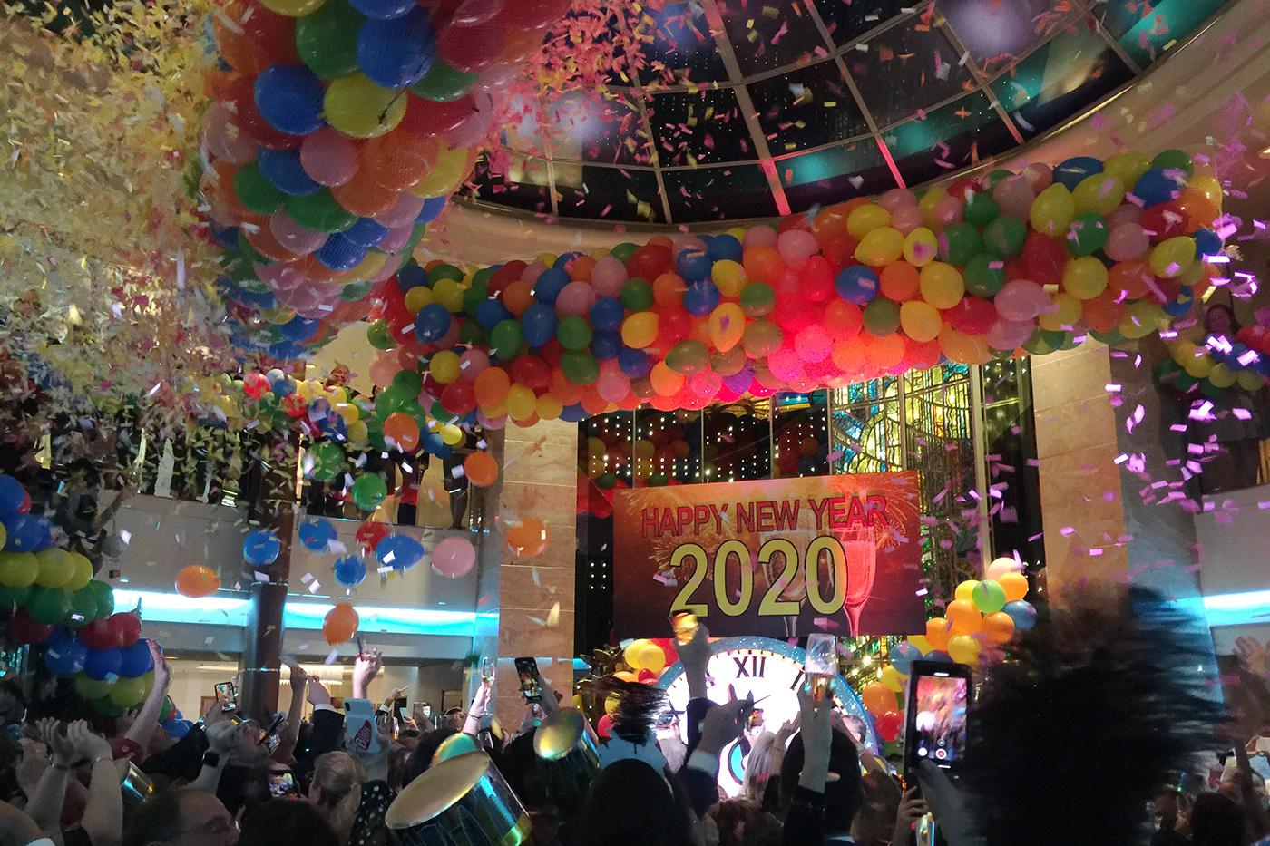 Crystal Serenity rings in 2020 with balloons, confetti and a packed atrium celebration. Photo: Gerry Barker