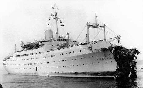Stockholm returns to New York with severe bow damage after the 1956 collision with Andrea Doria. From the William H. Miller Collection.